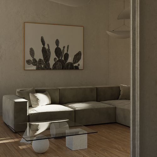A modern living room scene featuring a low gray sectional sofa with a large framed black and white cactus drawing on the textured beige wall above it. A glass-top coffee table sits in front of the sofa on light wood flooring.